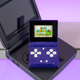 The FunKey S handheld sitting on a Game Boy Advance SP.